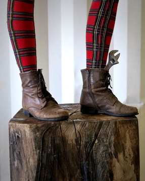 A travel blogger in weathered boots